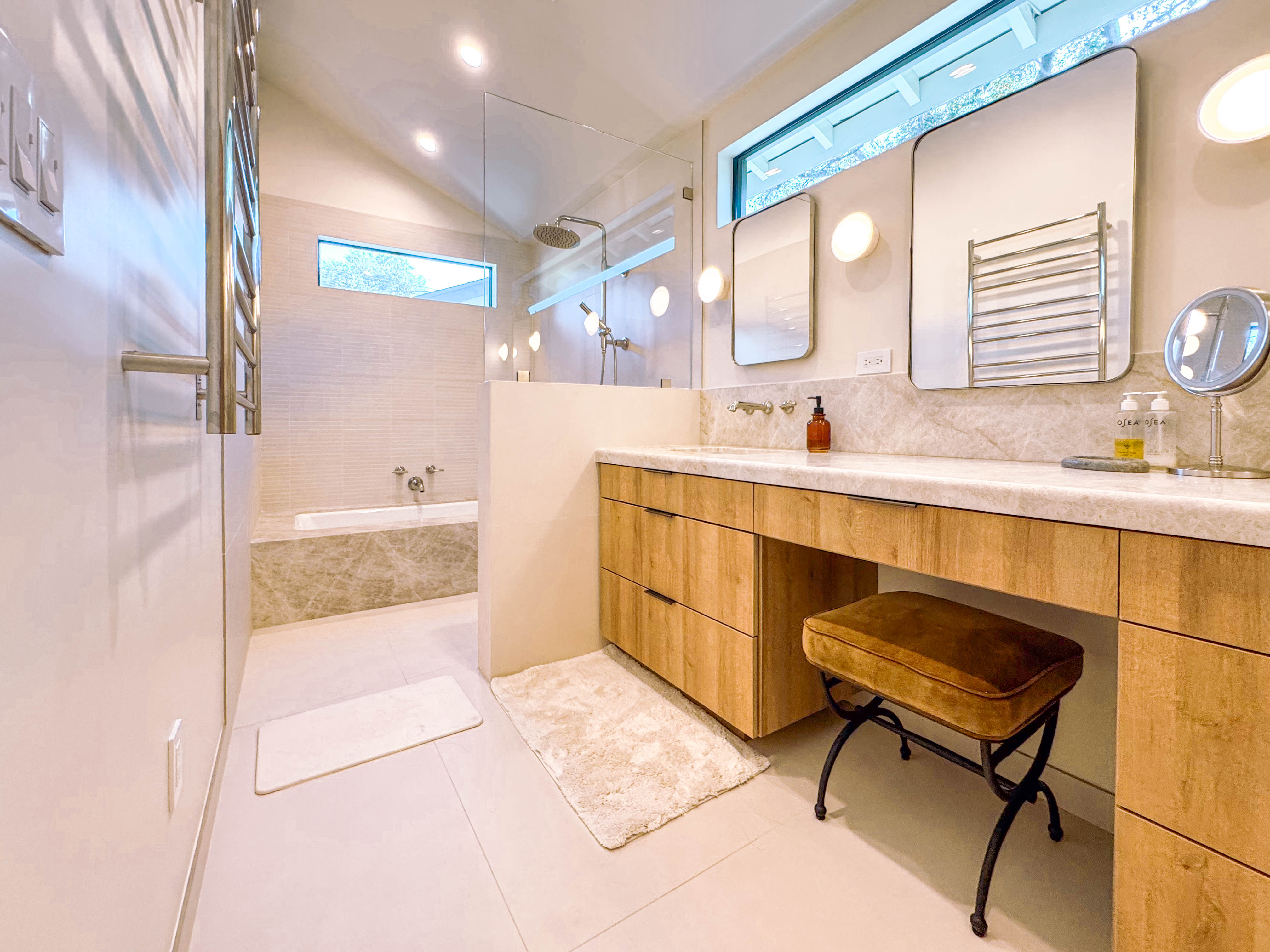 Primary bathroom with oak vanity and walk-in shower